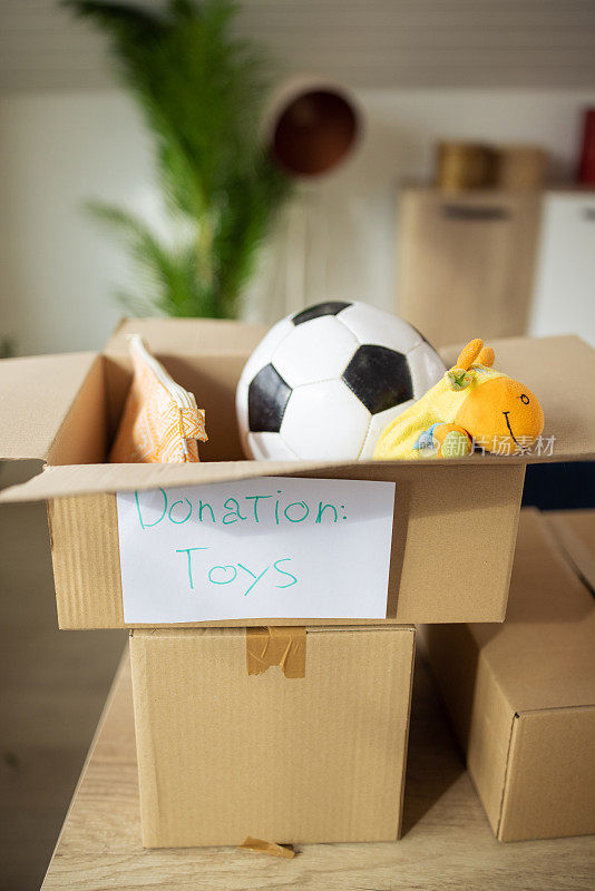 Cardboard boxes with toys, prepared for donation